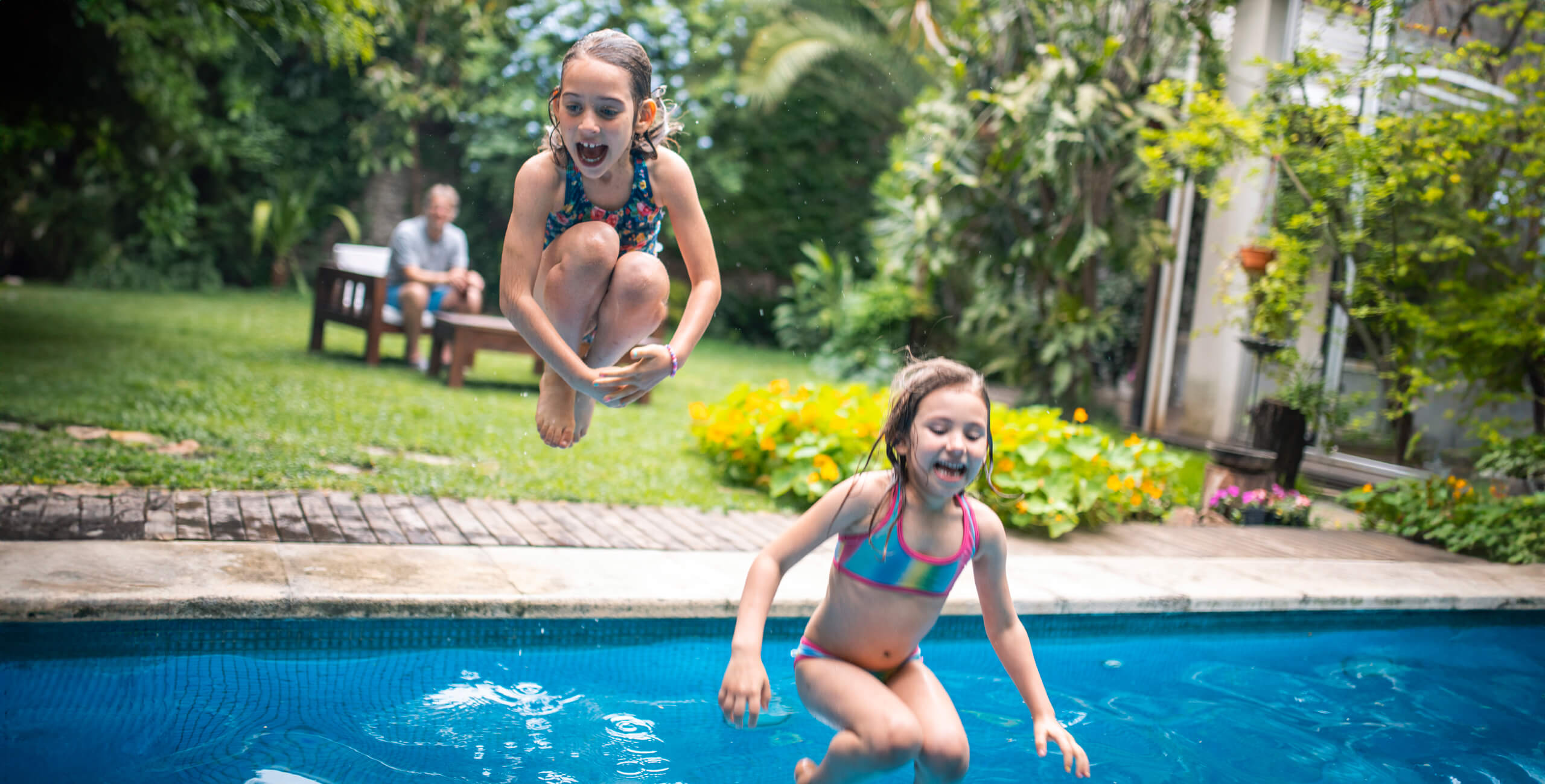 GirlsJumpingInPool